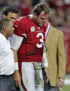 Arizona Cardinals quarterback Carson Palmer (3) leaves after injuring his left knee during the second half of an NFL football game against the St. Louis Rams, Sunday, Nov. 9, 2014, in Glendale, Ariz. (AP Photo/Rick Scuteri)