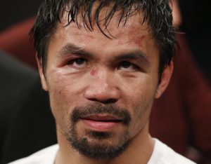 Manny Pacquiao, from the Philippines, waits after the welterweight title fight against Floyd Mayweather Jr., on Saturday, May 2, 2015 in Las Vegas.  (AP Photo/John Locher)
