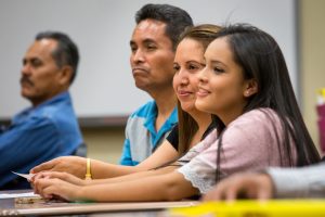 20150506 – ASU News – Dream Academy – Jamie and Patricia Fabian, along with their 15-year-old daughter Yenifer, attend the American Dream Academy, at Trevor Browne High School in Phoenix, on Wednesday, May 6, 2015. The program is a free, 10-week "parent empowerment program" for Latinos to inform parents about the requirements for college and different ways of paying for it. The Fabians are the 30,000th parents to complete the program. They have a son, Jaime Jr., 19, who already attends ASU. The school principal, Dr. Gabriel Trujillo taught the class. Photo by Charlie Leight/ASU News