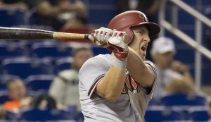 Arizona Diamondbacks' Cliff Pennington (4) reacts after he hit a ball that drove home a run during the sixth inning of a baseball game against the Miami Marlins in Miami, Thursday, May 21, 2015. The Diamondbacks won 7-6, sweeping the series. (AP Photo/J Pat Carter)