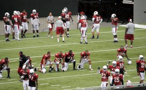 The Arizona Cardinals run drills during an NFL football training camp, Monday, Aug. 11, 2014, in Glendale, Ariz. (AP Photo/Matt York)