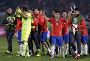 Chile's Gary Medel , center right, celebrates with teammates after a Copa America semifinal soccer match against Peru at the National Stadium in Santiago, Chile, Monday, June 29, 2015. Chile won 2-1.(AP Photo/Ricardo Mazalan)