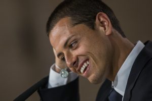 Mexico's international soccer player Javier Hernandez 'Chicharito', gestures at a press conference during his official presentation at the Santiago Bernabeu stadium in Madrid, Spain, Monday, Sept. 1, 2014, after signing for Real Madrid. (AP Photo/Andres Kudacki)