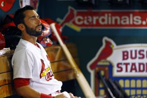 St. Louis Cardinals' Matt Carpenter sits in the dugout during the seventh inning of a baseball game against the Kansas City Royals, Friday, June 12, 2015, in St. Louis. The Cardinals won 4-0. (AP Photo/Billy Hurst)