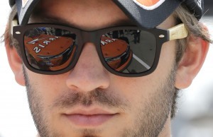 Daniel Suarez (18) checks his car before the NASCAR Xfinity series auto race at Chicagoland Speedway, Sunday, June 21, 2015, in Joliet, Ill. (AP Photo/Nam Y. Huh)