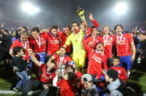 Chile's players celebrate with the Copa America trophy after defeating Argentina in the final soccer match at the National Stadium in Santiago, Chile, Saturday, July 4, 2015. Chile became Copa America champions for the first time after defeating Argentina in a penalty shootout. (AP Photo/Luis Hidalgo)