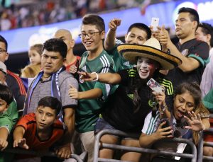 Fans cheer for Mexico's players leaving the field overtime period at a CONCACAF Gold Cup soccer match against Costa Rica Sunday, July 19, 2015, at MetLife stadium in East Rutherford, N.J. Mexico won 1-0. (AP Photo/Mel Evans)