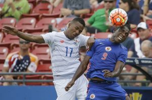 Haiti forward Kervens Belfort (9) and Panama defender Luis Henriquez (17) jump for a head ball during the first half of a CONCACAF Gold Cup soccer match in Frisco, Texas, Tuesday, July 7, 2015. (AP Photo/LM Otero)