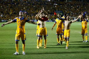Players of Mexico's Tigres celebrate their 3-1 victory over Brazil Internacional at the end of their Copa Libertadores semi-final soccer match in Monterrey, Mexico, Wednesday, July 22, 2015. Tigres will face Argentina's River Plate in the final. (AP Photo/Alfredo Lopez)