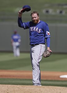 Texas Rangers' Tommy Hanson in action during a spring exhibition baseball game against the Kansas City Royals Saturday, March 22, 2014, in Surprise, Ariz. (AP Photo/Darron Cummings)