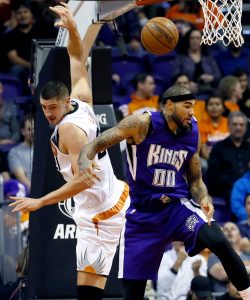 Sacramento Kings' Willie Cauley-Stein (00) and Phoenix Suns' Alex Len loses the ball during the first half of an NBA basketball game, Wednesday, Nov. 4, 2015, in Phoenix. (AP Photo/Matt York)