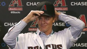 Arizona Diamondbacks pitcher Zack Greinke talks to the media during a press conference, Friday, Dec. 11, 2015, in Phoenix. Greinke could have stayed with the Los Angeles Dodgers or gone up the coast to the San Francisco Giants. Instead, he signed a massive contract with the Arizona Diamondbacks, dramatically shifting the landscape in the NL West.   (AP Photo/Rick Scuteri)