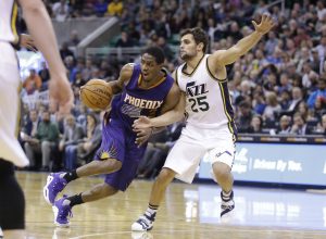 Phoenix Suns guard Brandon Knight (3) drives around Utah Jazz guard Raul Neto (25) during the second half of an NBA basketball game Monday, Dec. 21, 2015, in Salt Lake City. The Jazz won 110-89. (AP Photo/Rick Bowmer)