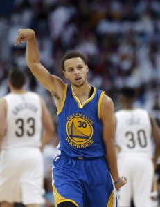 Golden State Warriors' Stephen Curry (30) reacts after hitting a 3-point basket during the second half of Game 4 of a first-round NBA basketball playoff series against the New Orleans Pelicans in New Orleans, Saturday, April 25, 2015. The Warriors won 109-98 to sweep the series. (AP Photo/Gerald Herbert)