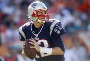 New England Patriots quarterback Tom Brady looks for a receiver during the second half of an NFL football game against the Miami Dolphins, Sunday, Dec. 2, 2012, in Miami. (AP Photo/John Bazemore)