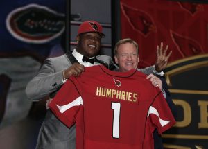 D.J. Humphries stands on stage with NFL commissioner Roger Goodell, right, after being drafted 24th by the Arizona Cardinals during the first round of the 2015 NFL Draft, Thursday, April 30, 2015, in Chicago.  (Jeff Haynes/AP Images for Panini)