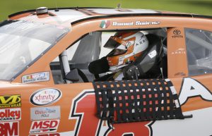 Daniel Suarez drives his car through the pit area during qualifying for the NASCAR Xfinity Series auto race, Saturday, Aug. 1, 2015, at Iowa Speedway in Newton, Iowa. Suarez won the pole position for the race. (AP Photo/Charlie Neibergall)