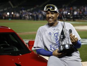 Kansas City Royals catcher Salvador Perez poses with his trophy after being named the MVP after Game 5 of the Major League Baseball World Series against the New York Mets Monday, Nov. 2, 2015, in New York. The Royals won 7-2 to win the series. (AP Photo/Matt Slocum)