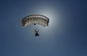 A member of Iraq's national skydiving team parachutes during a training session in Kut, 100 miles (160 kilometers) southeast of Baghdad, Iraq, Friday, Oct. 13, 2015. (AP Photo/Hadi Mizban)